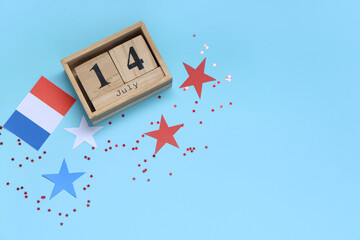 Cube calendar with date 14 JULY, French flag and stars on red background. Bastille Day celebration