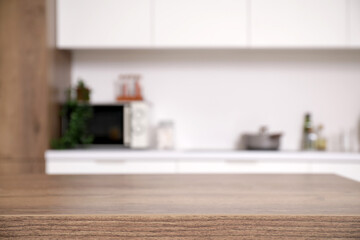 Wooden table in modern kitchen, closeup