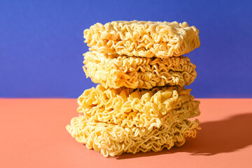 Raw instant noodles on colorful background