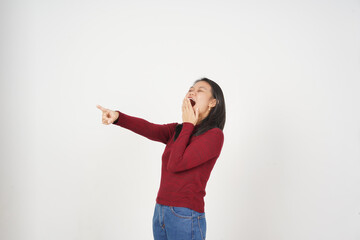 Fototapeta premium Young Asian woman pointing and laughing wearing Red t-shirt isolated on white background