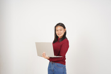 Fototapeta premium Young Asian woman working on laptop wearing red t-shirt isolated on white background