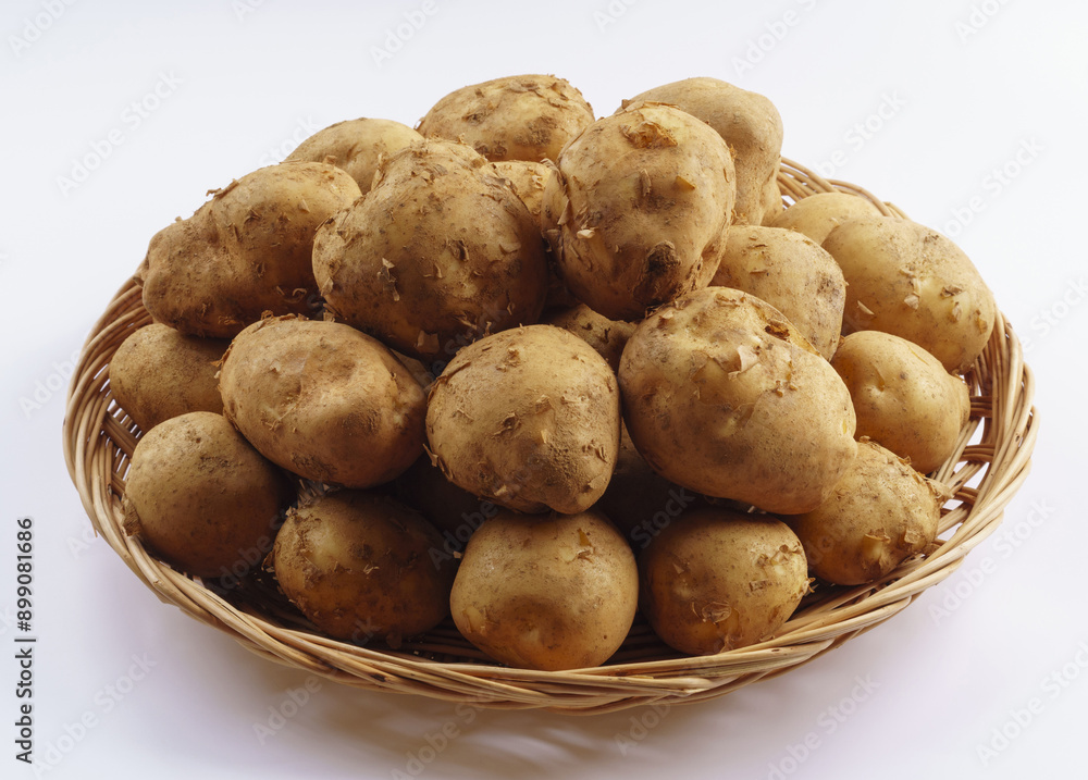 Poster Close-up of stacked raw potatos on bamboo basket, South Korea
