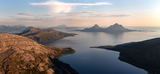 Panoramic view over the island of Tomma, helgeland, Norway in the midnight sun. Seen from over Smaltind, Breitind and Tortenviktind. Nighttime summer Norwegian hiking, fjelltur. Dusk and dawn, arctic
