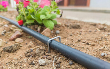 U pins or hold down pegs installed over pipe