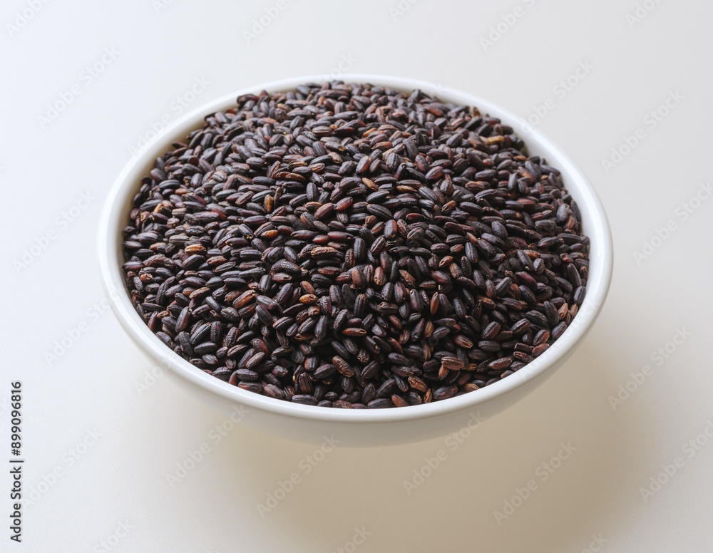 Wall mural Close-up of stacked dried raw black rice on a dish, South Korea
