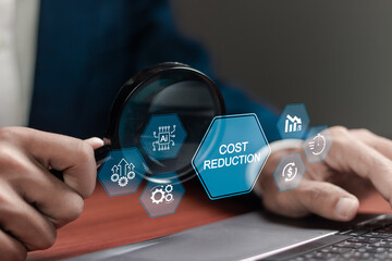 Cost reduction using (AI) artificial intelligence technology. Businessman using laptop with cost...