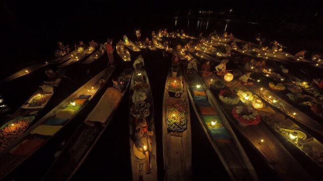 Damnoen Saduak Floating Market or Amphawa. Local people sell fruits, traditional food on boats in canal, Ratchaburi District, Thailand. Famous Asian tourist attraction destination. Festival in Asia.