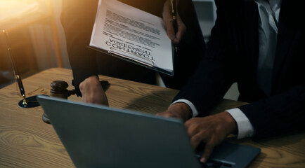 Judge gavel with Justice lawyers having team meeting at law firm background. Concepts of Law and...