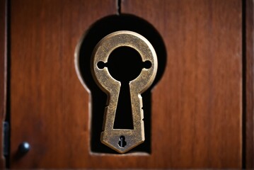 A close-up of a keyhole, creating a sense of mystery and intrigue.