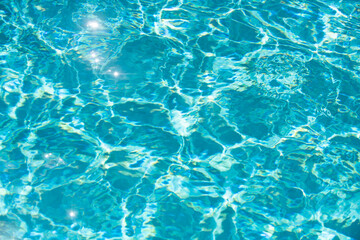 Blue ripped water in swimming pool, water pool texture and surface water backgraund.
