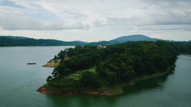 Aerial drone View of Mountain & Lake Drone footage, of river and beautiful natural green forests on a sunny summer day in, Umiam Lake, Meghalaya