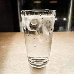 A glass of water with ice.