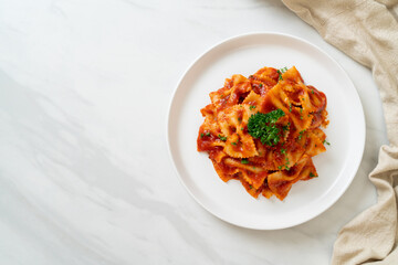 farfalle pasta in tomato sauce with parsley