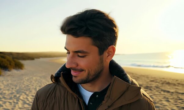 Medium shot portrait video of a satisfied man in his 30s wearing a warm parka against a summer landscape or beach background