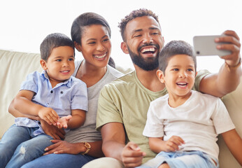 Happy, family and selfie on sofa for love, support and fun memories in living room. Parents, kids and phone on couch for relationship development, social media and smile at home for photography