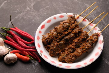 Clam Satay. Sate Kerang. Made from clams, chili, garlic, salt, spices. Blood clams are a type of clam commonly eaten by East and Southeast Asians. Tegillarca granosa. Indonesian food.