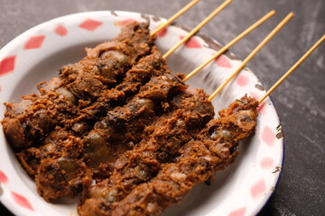 Clam Satay. Sate Kerang. Made from clams, chili, garlic, salt, spices. Blood clams are a type of clam commonly eaten by East and Southeast Asians. Tegillarca granosa. Indonesian food.