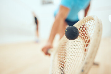 Man, playing and court or squash match, rubber ball and racket for sport with energy or fitness in...