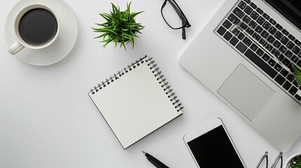 Minimalist Office Desk Setup with Laptop, Notebook, and Coffee