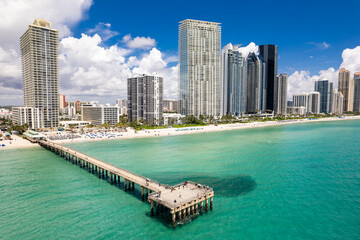 Sunny Isles Beach, Florida - Aerial of Newport Fishing Pier, with luxury condos lining the...