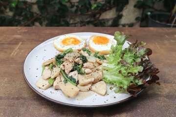 stir-fried chicken with mushroom and kale , sunny side up egg and lettuce