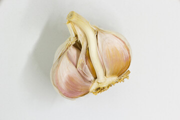 half of garlic on a white background
