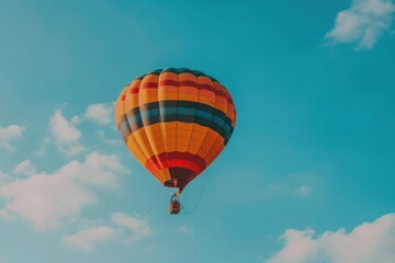 Fototapeta premium colorful hot air balloon flying on blue sky. adventure