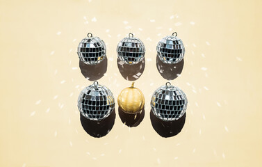 Arrangement of disco balls and tiny pumpkin.