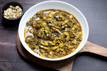Aluche fatfate or alu wal chi patal bhaji is a traditional, authentic Maharashtrian dish. colocasia leaves and lima beans curry. It has a sweet and sour taste. Valachi aamti. Fadfade. Monsoon recipes.