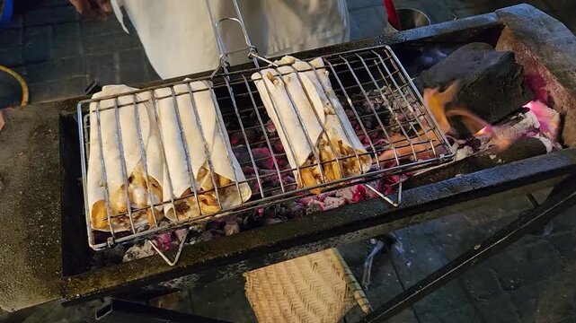 Person making Grilled shawarma chipotle street food