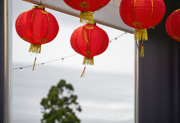Obraz premium Red lanterns hanging under doors and ceiling. Chinese New Year celebration. Auckland.