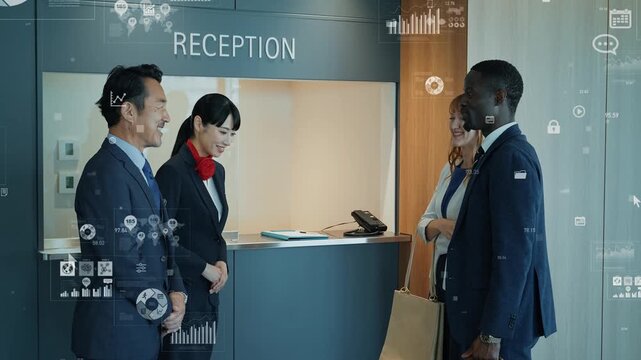 外国人訪問者を接客するスタッフのグループとビジネスデータ