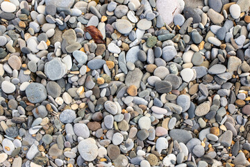 Background texture of sea pebbles, round small stones.