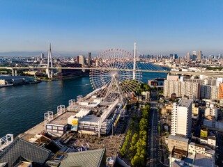 Drone footage of Tempozan Ferris Wheel and Tempozan Bridge before sunset, Osaka, Japan