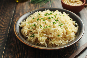 A bowl with traditional German Sauerkraut served in rustic style	