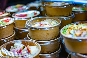 Vegetable salads displayed in a commercial refriger