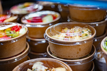 Vegetable salads displayed in a commercial refriger