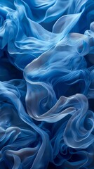 Fototapeta premium A tight shot of blue fabric featuring an expansive wave-like section in its center