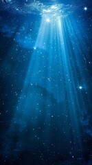  A deep blue ocean dotted with stars, crowned by a radiant beam of light piercing its surface