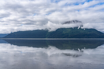 Turnagain Arm, It is one of two narrow branches at the north end of Cook Inlet, the other being Knik Arm. Turnagain is subject to climate extremes and large tide ranges. Kenai Mountains.
