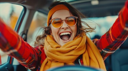 Joyful European woman celebrating successful car purchase, gesturing YES and shouting.