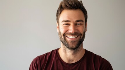 The smiling bearded man