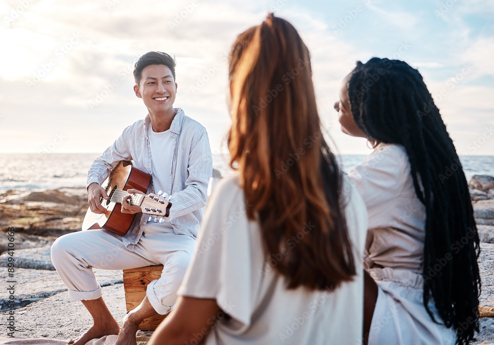 Wall mural Guitar, man and friends on beach for social, bonding and celebration in nature with music. Musician, instrument and entertainment on seaside with people, student gathering and reunion on vacation