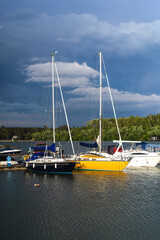 Yachts on a pier in the morning.