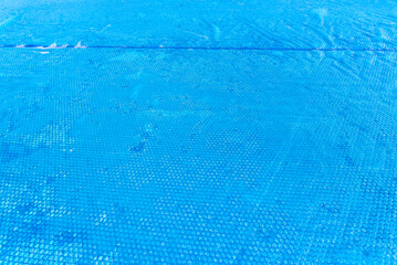 Large expansion pool with a diameter of 3.96 m, located in the yard on the grass, covered with a...