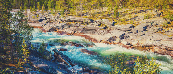 Mountain river with rocky banks. Beautiful nature of Norway. Horizontal Banner