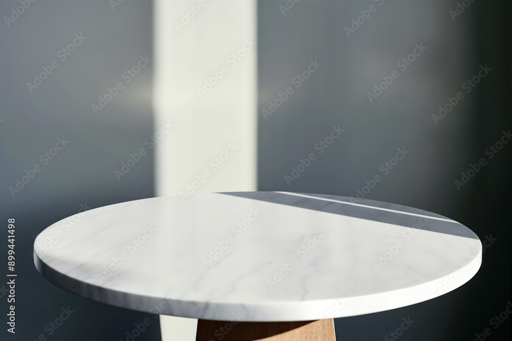 Poster empty white round marble table with sunlight shadows on grey wall background