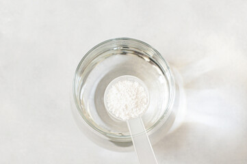 Powdered magnesium oxide or sulfate in a medicine spoon, water soluble drug group