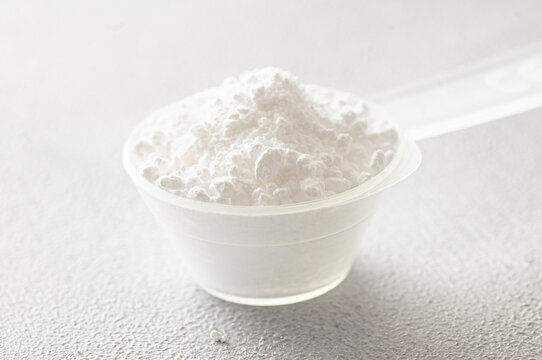 Powdered magnesium oxide or sulfate in a medicine spoon, water soluble drug group