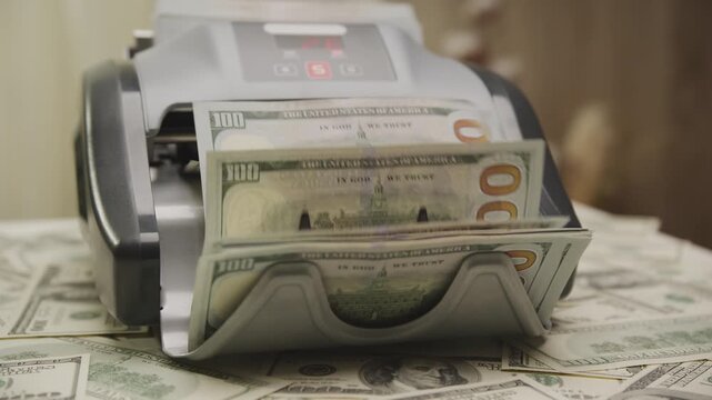 Cash Counting Machine with Stacks of Dollar Bills